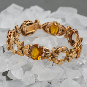 Pulsera antigua articulada en oro amarillo de 18kt con topacios naranjas.