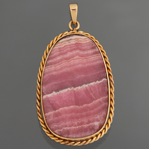 Colgante de ágata con orla de oro amarillo de 18 kt.