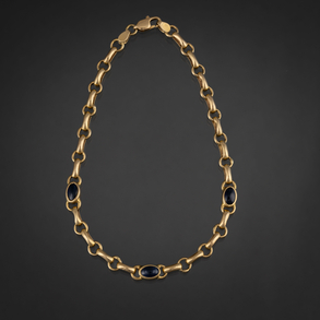 Pulsera de eslabones en oro amarillo de 18kt con tres cristales azules.