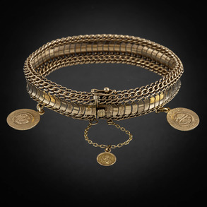 Pulsera articulada con dos medallas del signo del zodiaco en oro amarillo de 18 kt.