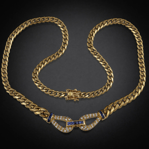 Gargantilla en oro amarillo de 18 kt con colgante en forma de lazo con brillantes y zafiros calibrados.