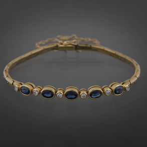 Pulsera en oro amarillo de 18 kt con brillantes y zafiros