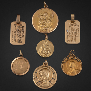 Conjunto de siete medallas compuesto por medallas de la Virgen y San José con el niño en oro amarillo de 18kt