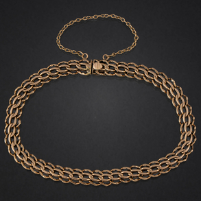 Pulsera de doble  eslabón barbado en oro amarillo de 18 kt.