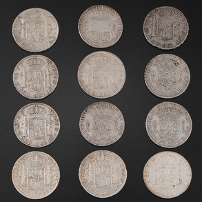 Conjunto de doce monedas de Reales de a Ocho de Carlos III