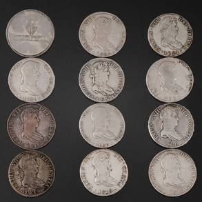 Conjunto de doce monedas de Reales de a Ocho de Fernando VII