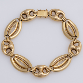 Bonita pulsera de eslabones  de calabrote y eslabones  cóncavos en oro amarillo de 18 kt.